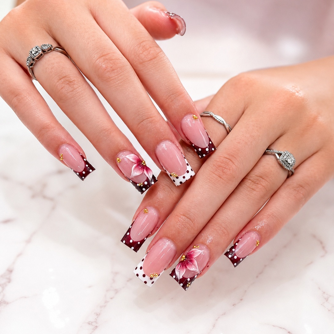 Burgundy French manicure with hand-painted floral accents